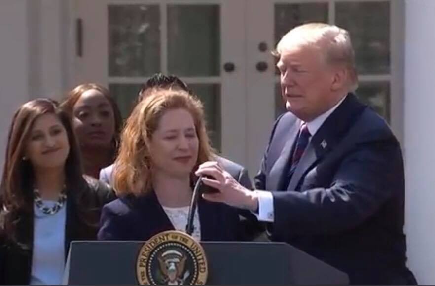 POTUS assists Nicole with microphone. Photo credit to US4Trump screen capture. 