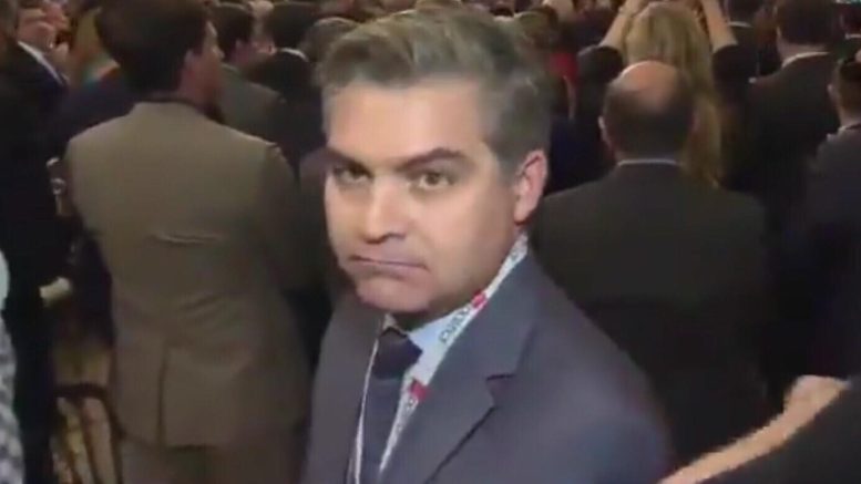 Acosta shouts from back of room at POTUS. Tries to overshadow 6 month Tax Cut anniversary. Photo credit to US4Trump screen grab.